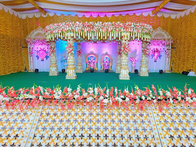 Decorated stage and floral arrangement at Shubham Gardens